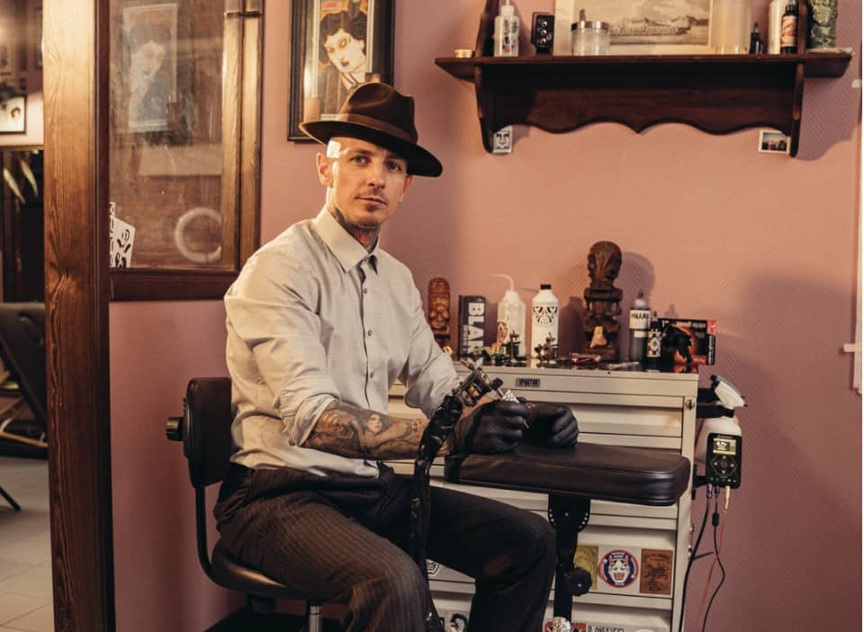 A Tattoo Artist Inside His Studio