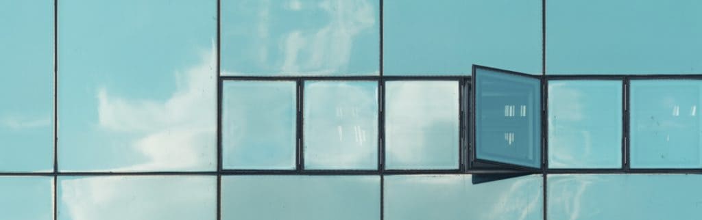 Open Glass Window with Reflection of Sky