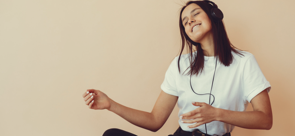 Copyright for Musicians: Who Owns the Copyright for A Song? 7 woman listening to songs