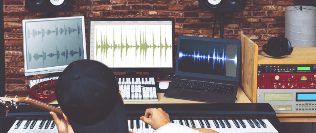 How Much Should I Charge for Film Score? 4 youngster has a laptop is making music.