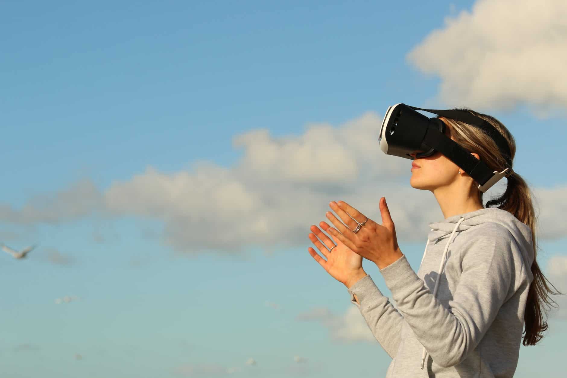 The Metaverse Sounds Like Hans Zimmer 31 woman using vr goggles outdoors