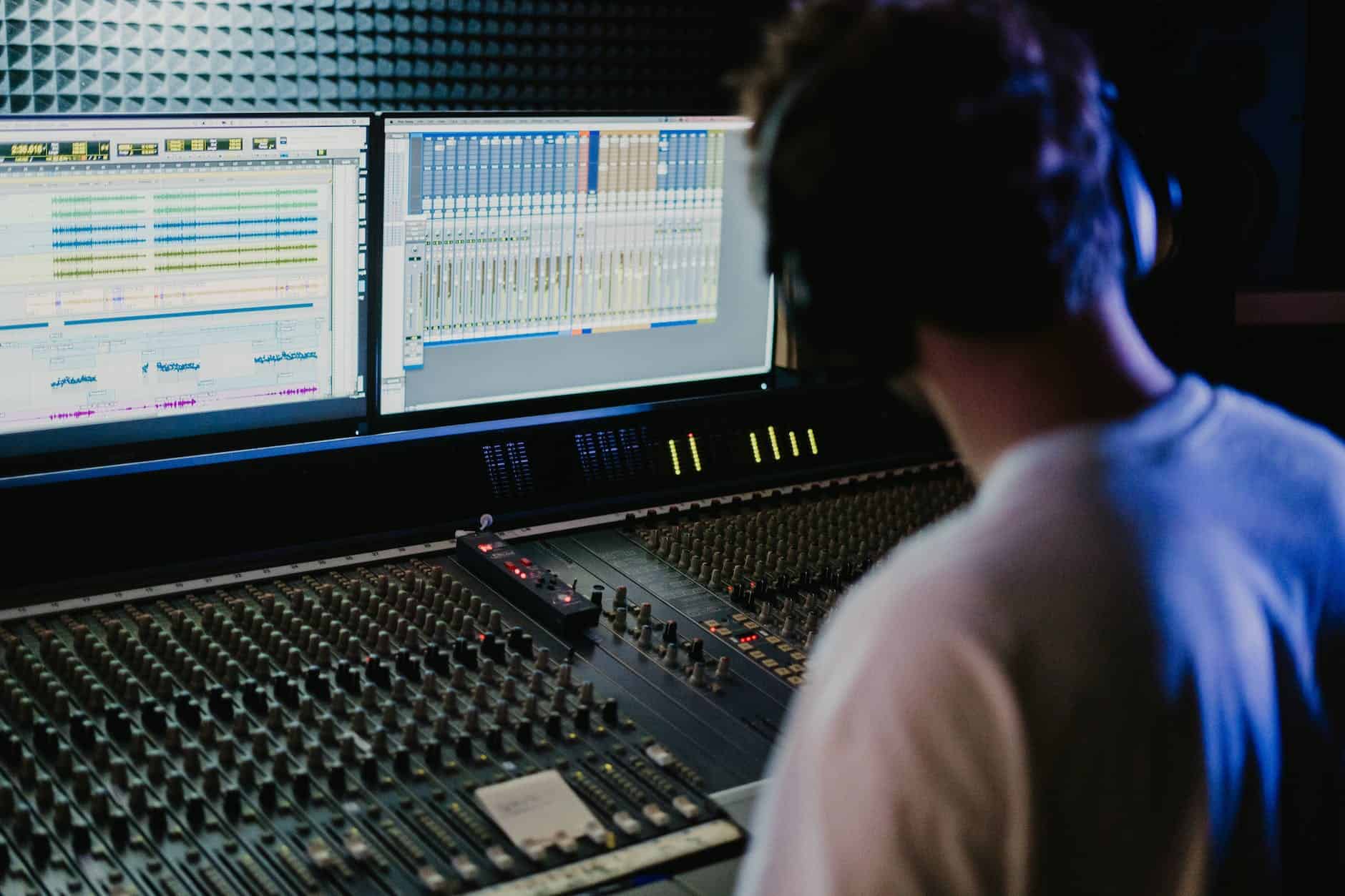 a man in control of the audio mixer